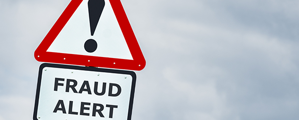 business fraud alert sign